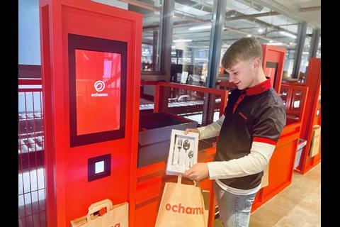 A person collects an item from the cashierless checkout at JD.com's new store.